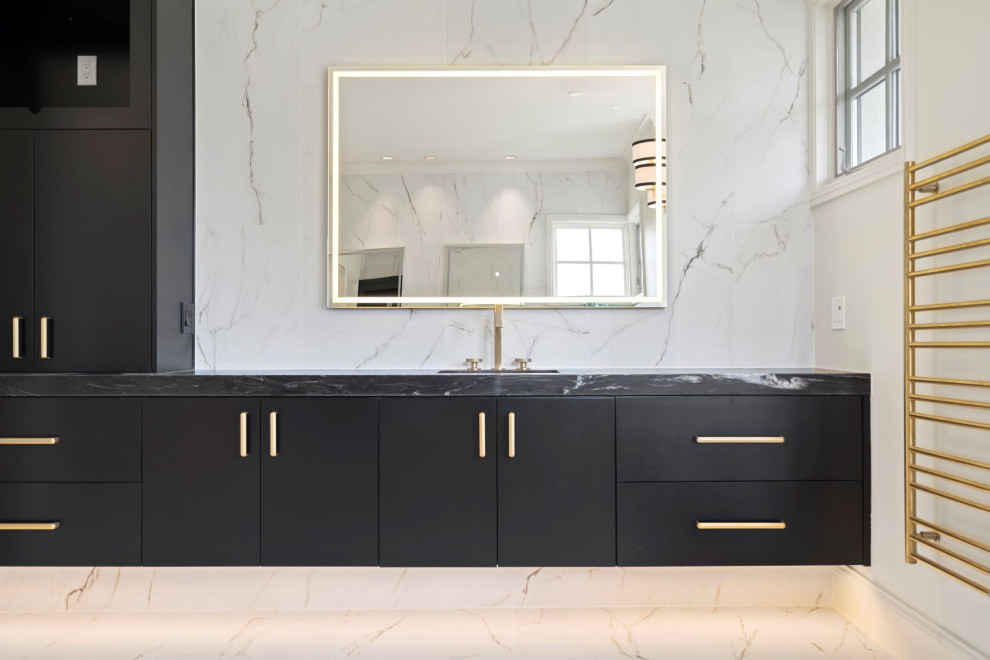 Large minimalist master white tile and marble tile marble floor and single-sink claw-foot bathtub photo in Kansas City with flat-panel cabinets, black cabinets, an undermount sink, granite countertops, a hinged shower door, black countertops, a niche and a floating vanity