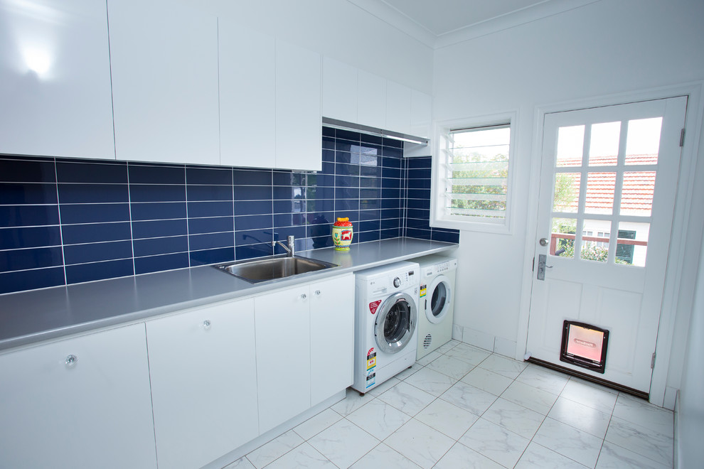 Photo of a contemporary laundry room in Brisbane.