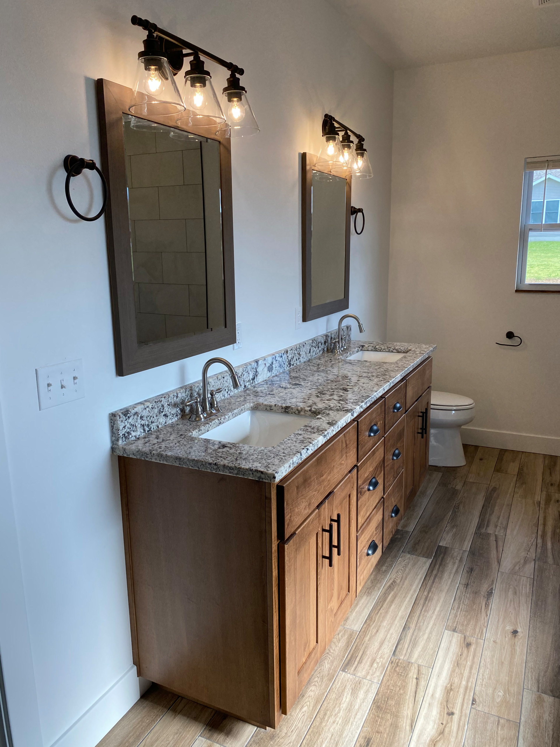 master custom stained bathroom vanity with granite countertop