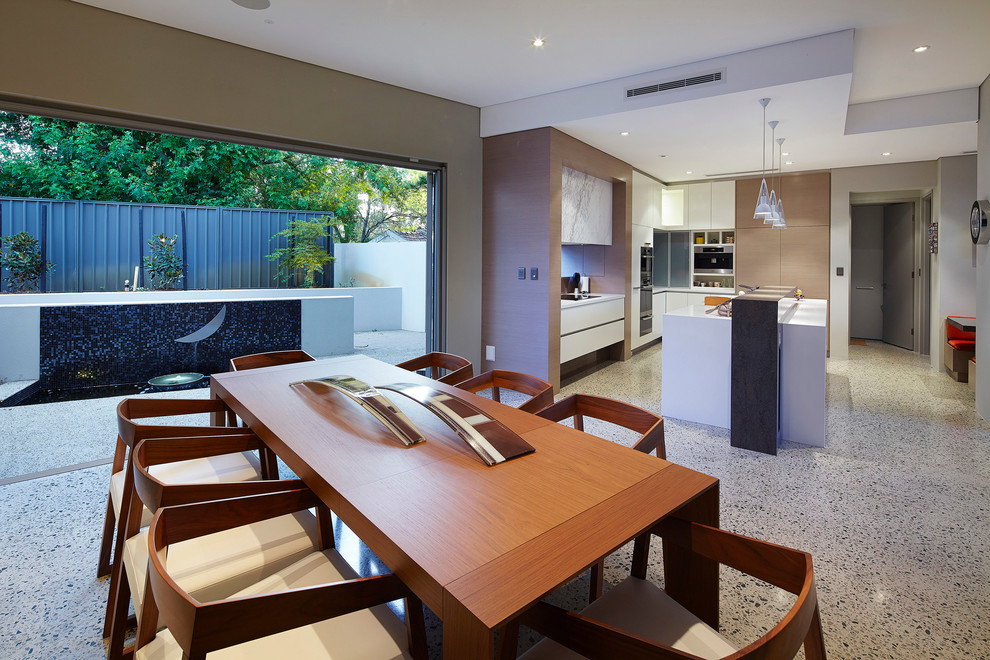 This is an example of a contemporary kitchen/dining combo in Perth with beige walls.