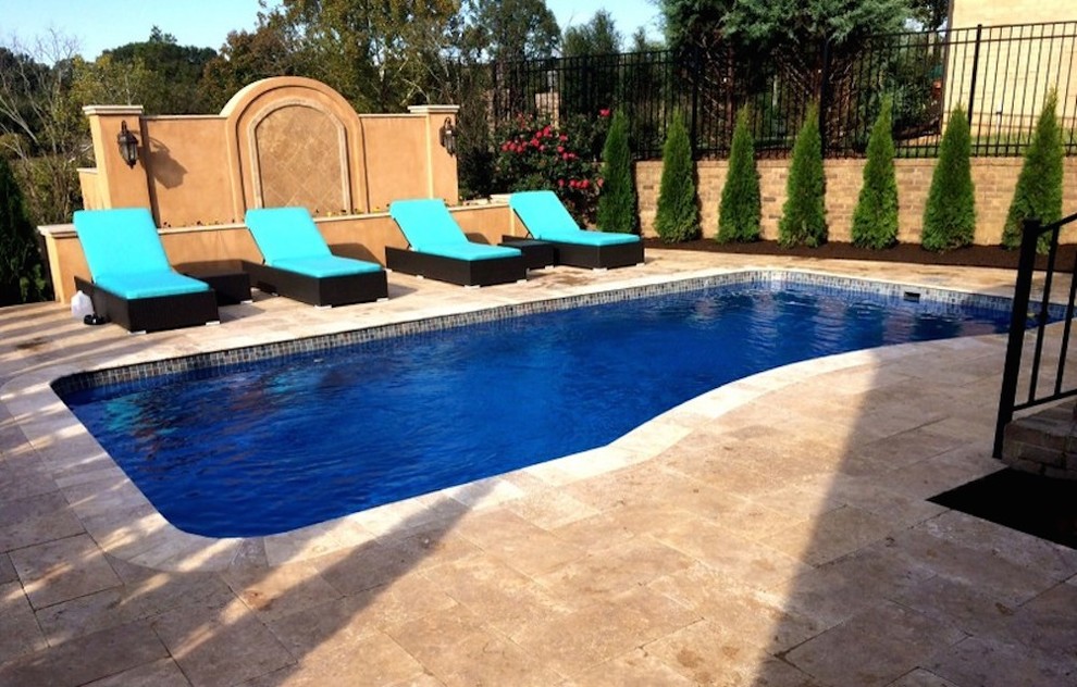 Inspiration for a mid-sized transitional backyard concrete paver and custom-shaped pool remodel in Nashville