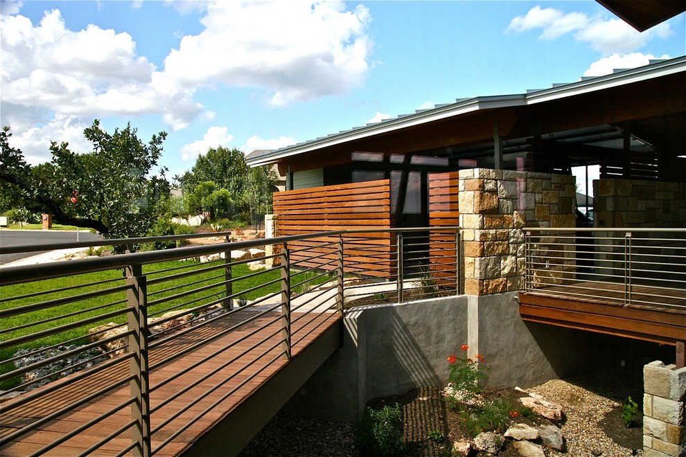 Large contemporary two-storey exterior in Austin with stone veneer.