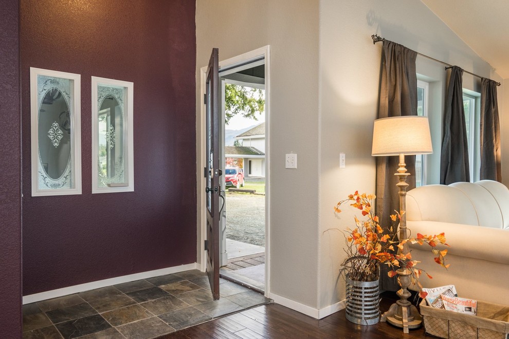 This is an example of a mid-sized transitional front door in Seattle with beige walls, slate floors, a single front door and a medium wood front door.