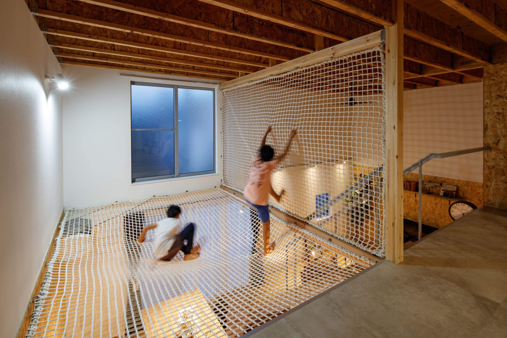 Photo of an industrial family room in Tokyo Suburbs with white walls, exposed beam and wallpaper.