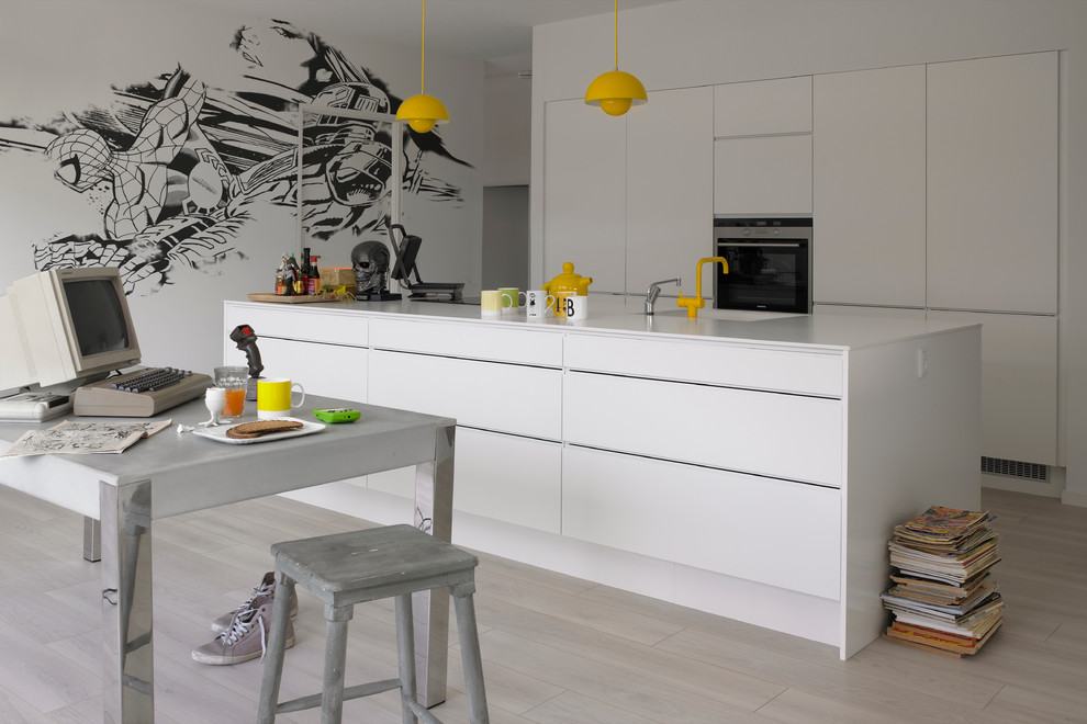This is an example of a large modern kitchen in Other with a drop-in sink, flat-panel cabinets, white cabinets and with island.