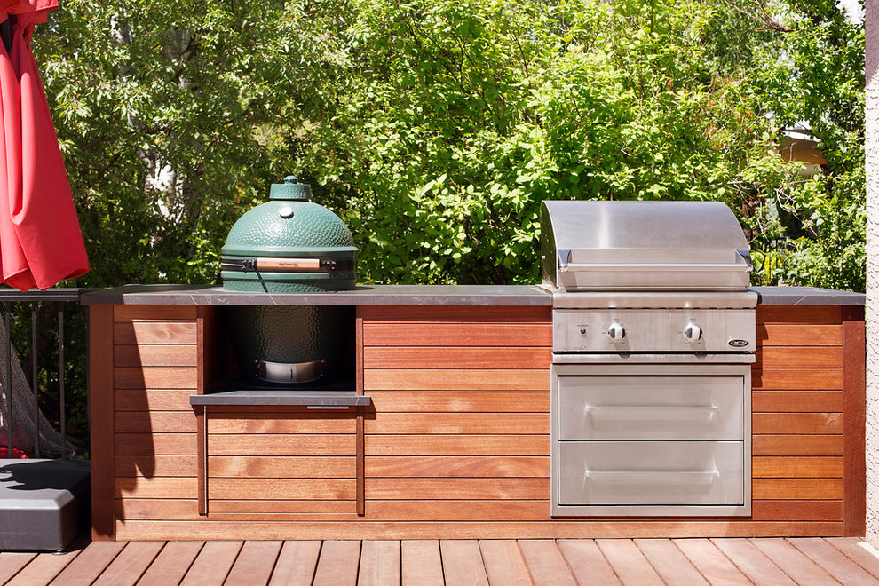 Example of a mid-sized transitional outdoor kitchen deck design in Calgary with no cover