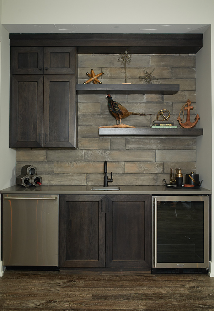 Inspiration for a transitional single-wall wet bar in Grand Rapids with an undermount sink, shaker cabinets, dark wood cabinets, brown splashback, dark hardwood floors and brown floor.