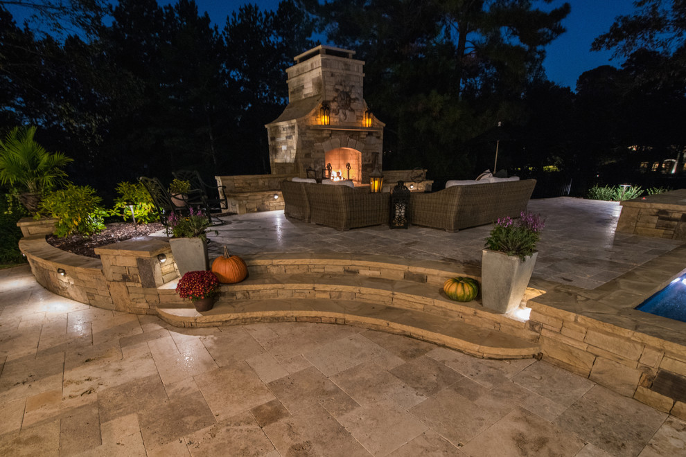 Large traditional backyard patio in Atlanta with a water feature and decking.