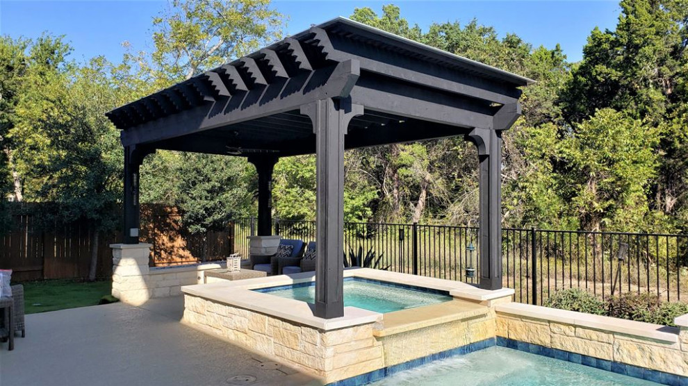 Photo of an expansive bohemian back veranda in Austin with a fire feature and a pergola.