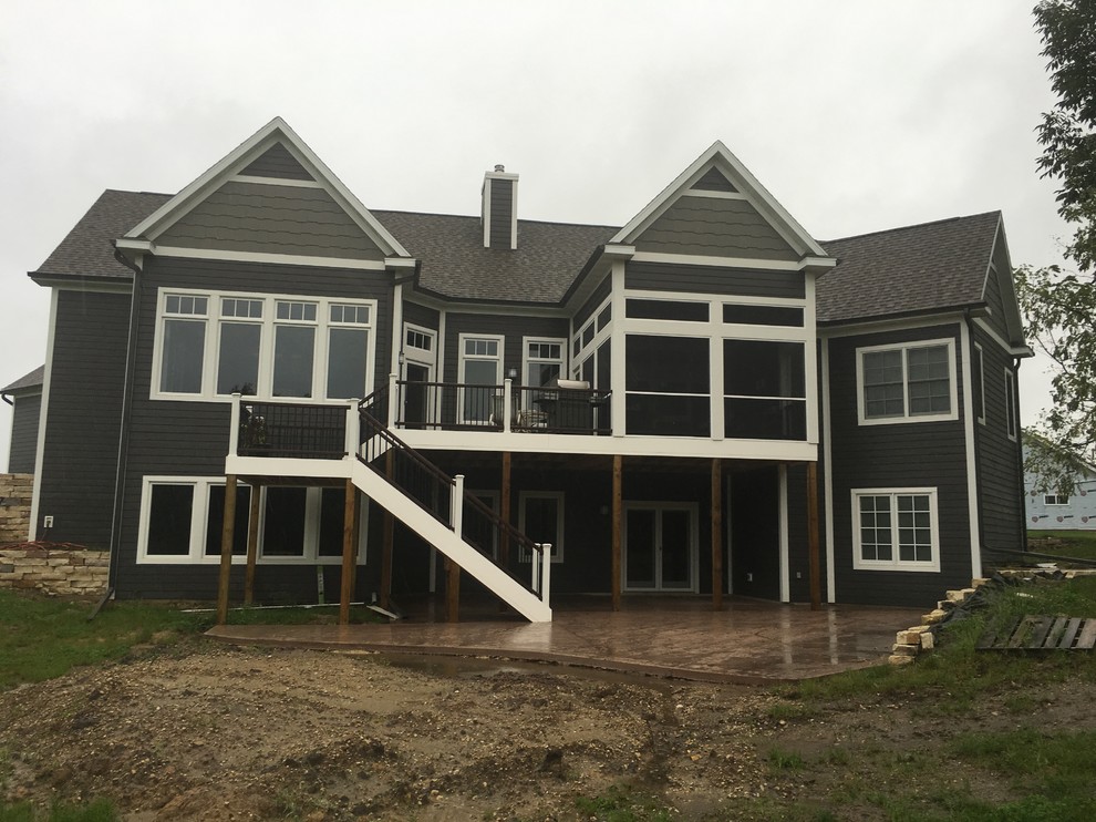 Inspiration for a mid-sized transitional backyard deck remodel with no cover