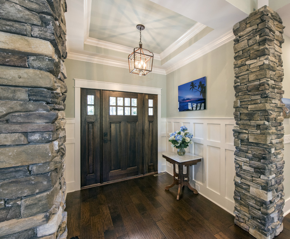 Arts and crafts foyer in Other with a single front door.