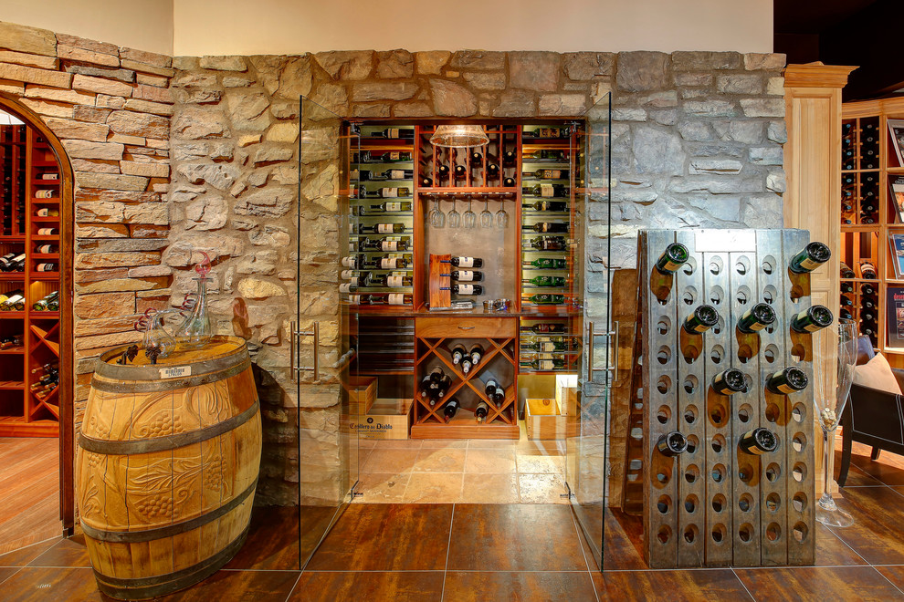 Example of a mid-sized transitional porcelain tile and black floor wine cellar design in Phoenix with display racks
