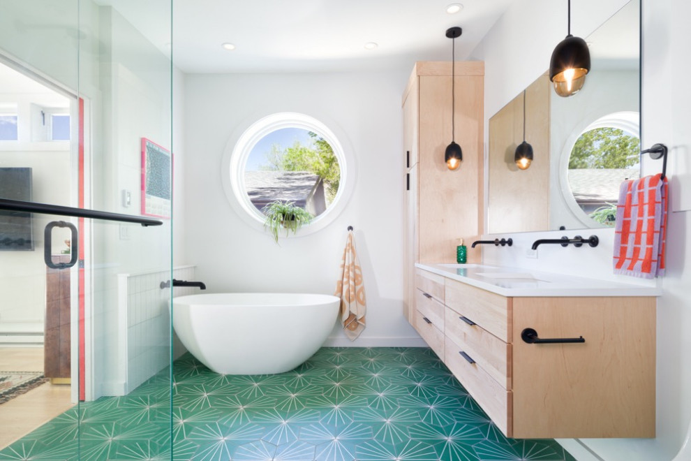 Eclectic cement tile floor, green floor and double-sink freestanding bathtub photo in Denver with a hinged shower door and a floating vanity