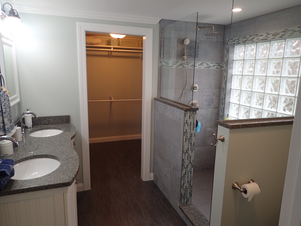 Design ideas for a mid-sized transitional master bathroom in Other with furniture-like cabinets, white cabinets, an alcove shower, a two-piece toilet, gray tile, matchstick tile, grey walls, dark hardwood floors, an undermount sink and engineered quartz benchtops.