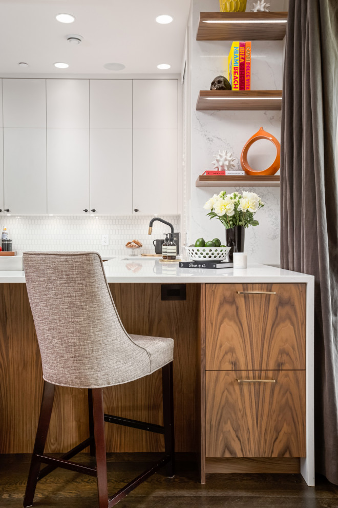 Example of a large trendy u-shaped open concept kitchen design in Vancouver with an undermount sink, flat-panel cabinets, medium tone wood cabinets, quartz countertops, white backsplash, ceramic backsplash, paneled appliances and white countertops