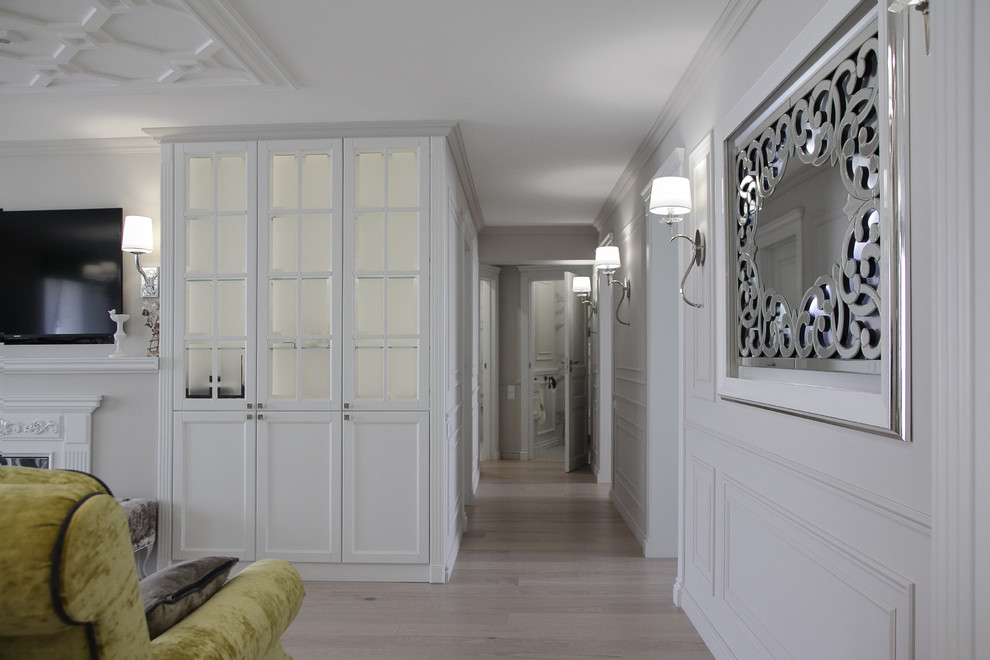 Photo of a mid-sized traditional hallway in Other with grey walls.