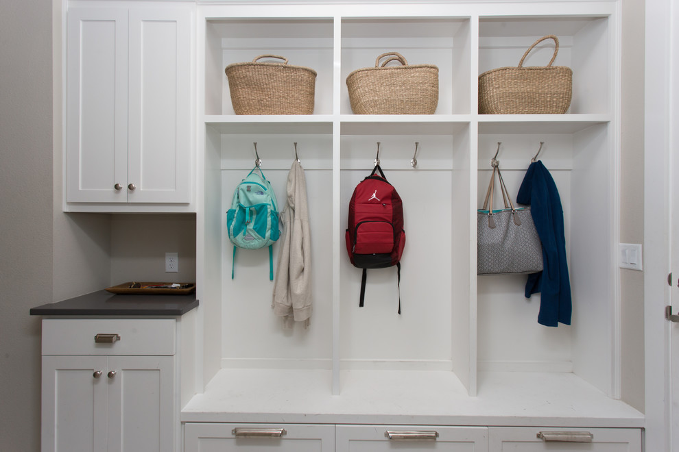 Mudroom - mid-sized transitional light wood floor and beige floor mudroom idea in Austin with beige walls