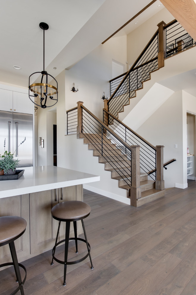 Inspiration for a country wood u-shaped staircase in Salt Lake City with wood risers and mixed railing.