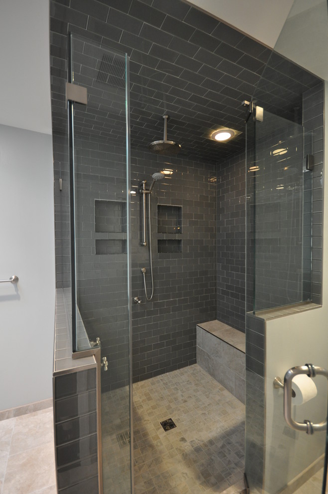 Inspiration for a mid-sized transitional master black tile and subway tile beige floor double shower remodel in DC Metro with shaker cabinets, black cabinets, a one-piece toilet, blue walls, a wall-mount sink and a hinged shower door