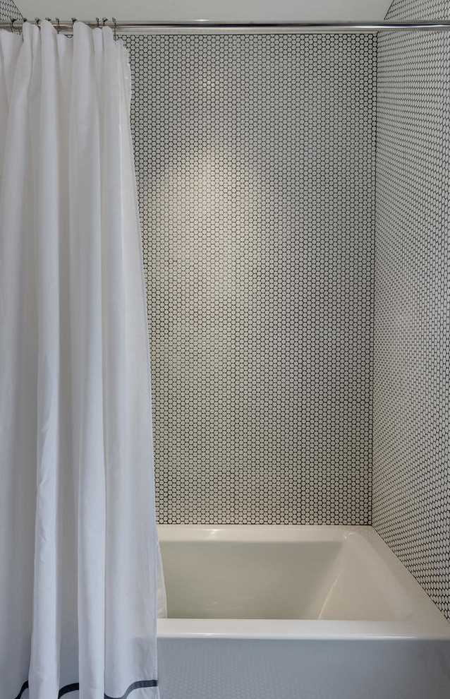 This is an example of a mid-sized transitional kids bathroom in Austin with flat-panel cabinets, grey cabinets, an alcove tub, a shower/bathtub combo, a one-piece toilet, gray tile, white tile, mosaic tile, multi-coloured walls, mosaic tile floors, an undermount sink, engineered quartz benchtops, white floor and a shower curtain.