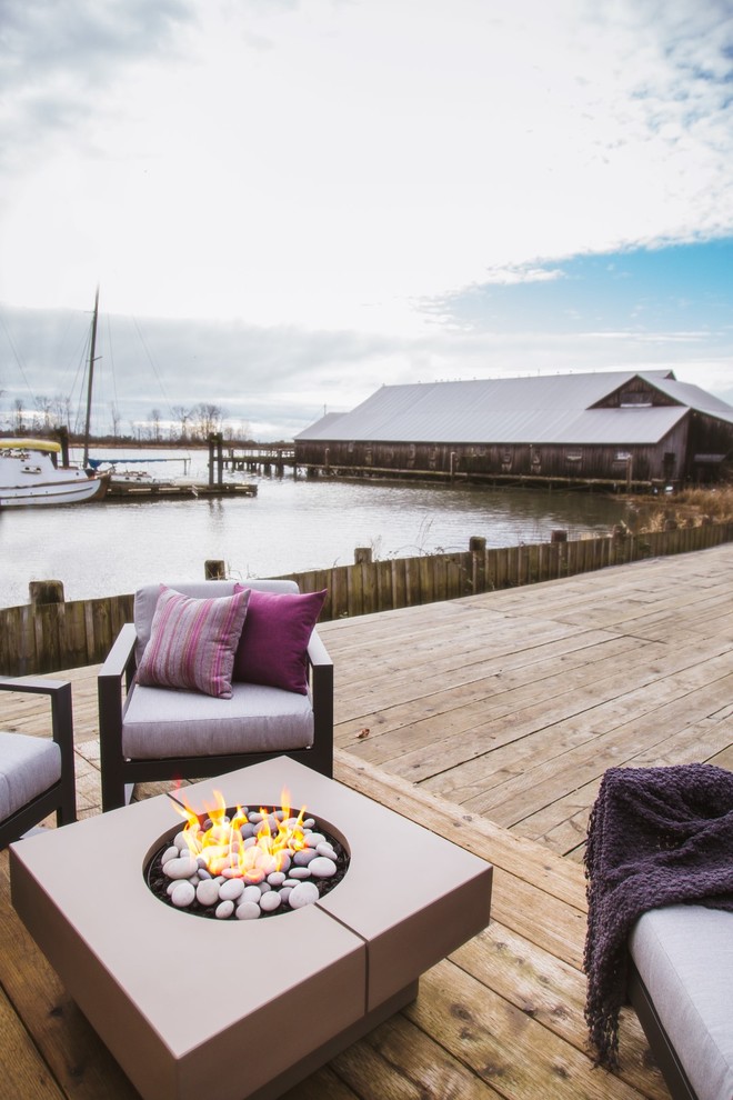 Patio - transitional backyard patio idea in Vancouver with a fire pit