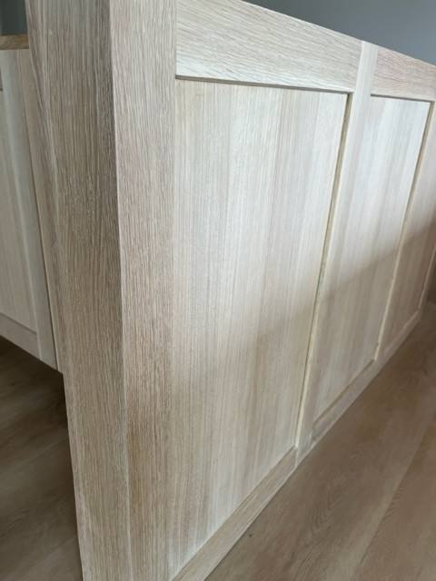 Example of a large kitchen design in Austin with shaker cabinets and an island