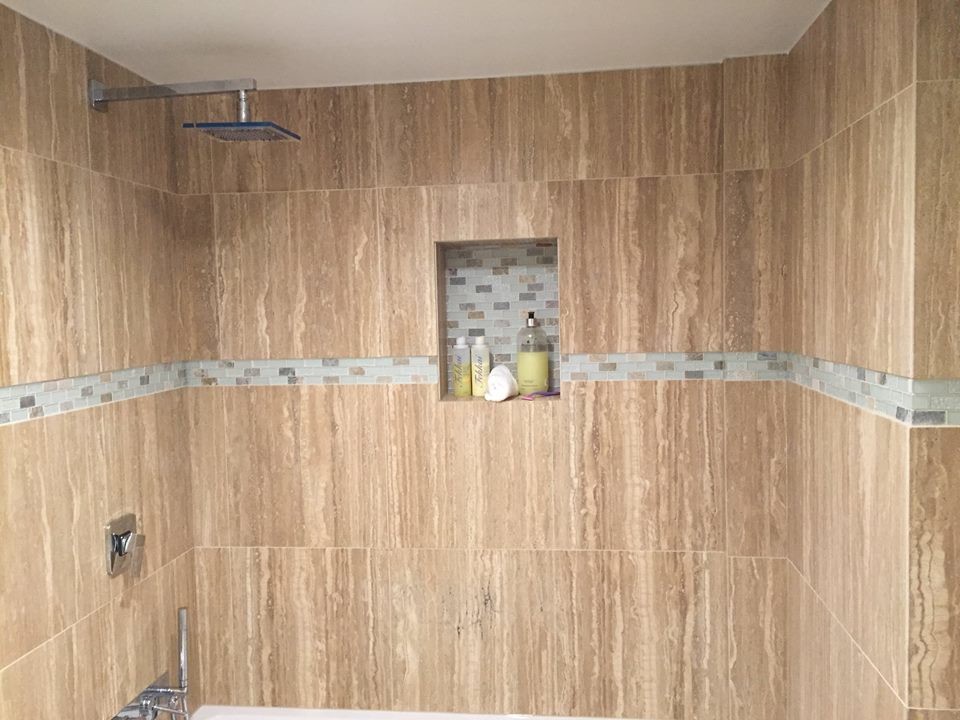 Photo of a small contemporary master bathroom in Cleveland with an alcove tub, a shower/bathtub combo, blue tile, glass tile, beige walls, ceramic floors and a vessel sink.