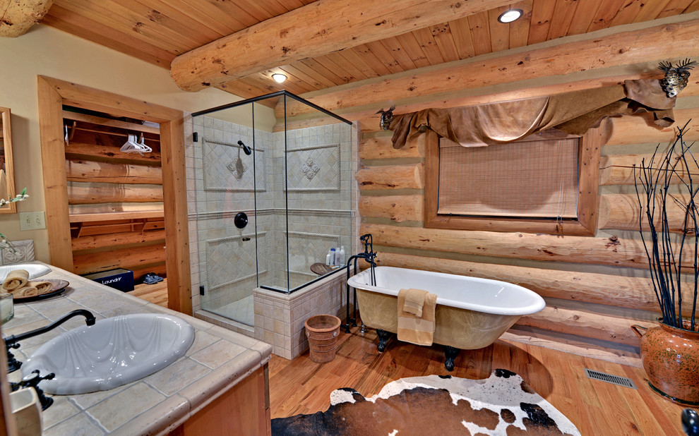 Design ideas for a traditional bathroom in Atlanta with a freestanding tub and tile benchtops.
