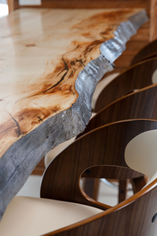 Inspiration for a large coastal indoor tile and custom-shaped natural staircase remodel in Calgary