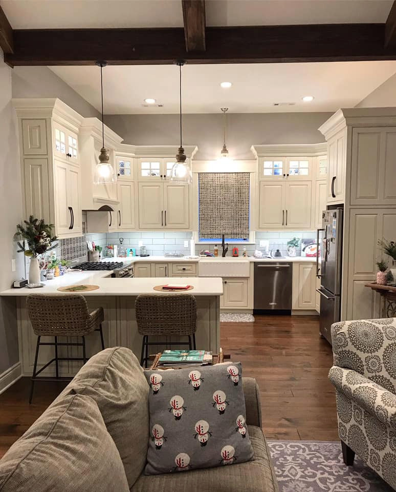 Inspiration for an eat-in kitchen in Other with a farmhouse sink, beaded inset cabinets, white cabinets, quartz benchtops, no island and white benchtop.