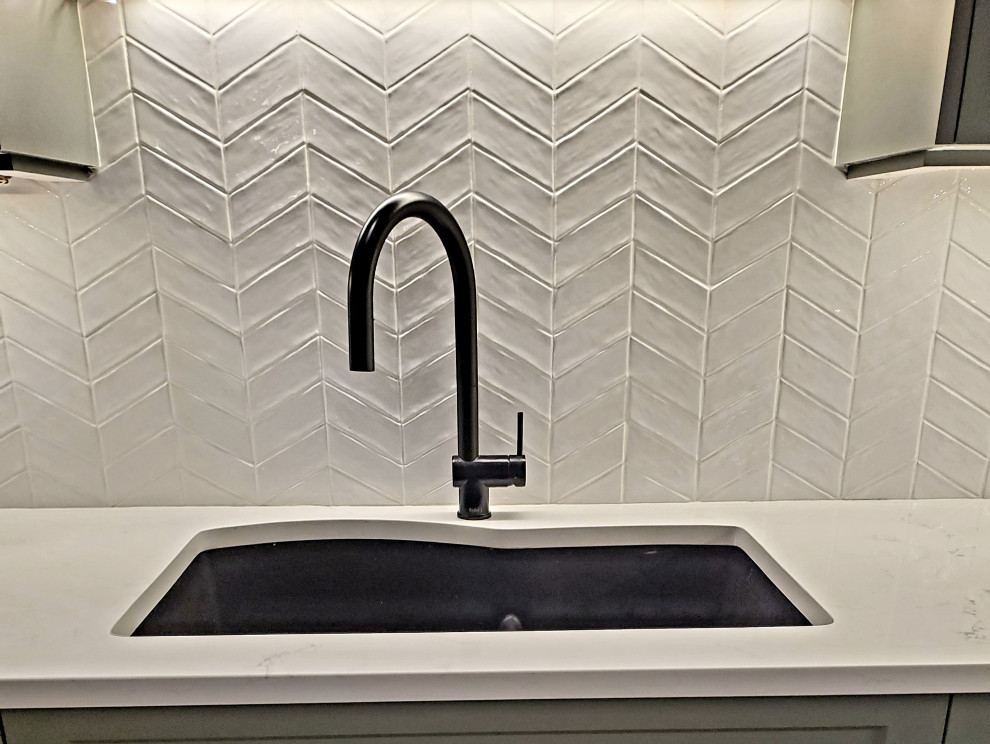 Example of a transitional home design design in Vancouver