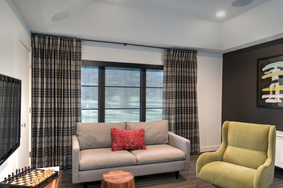 Small contemporary family room in Indianapolis with a game room, black walls, a wall-mounted tv and grey floor.