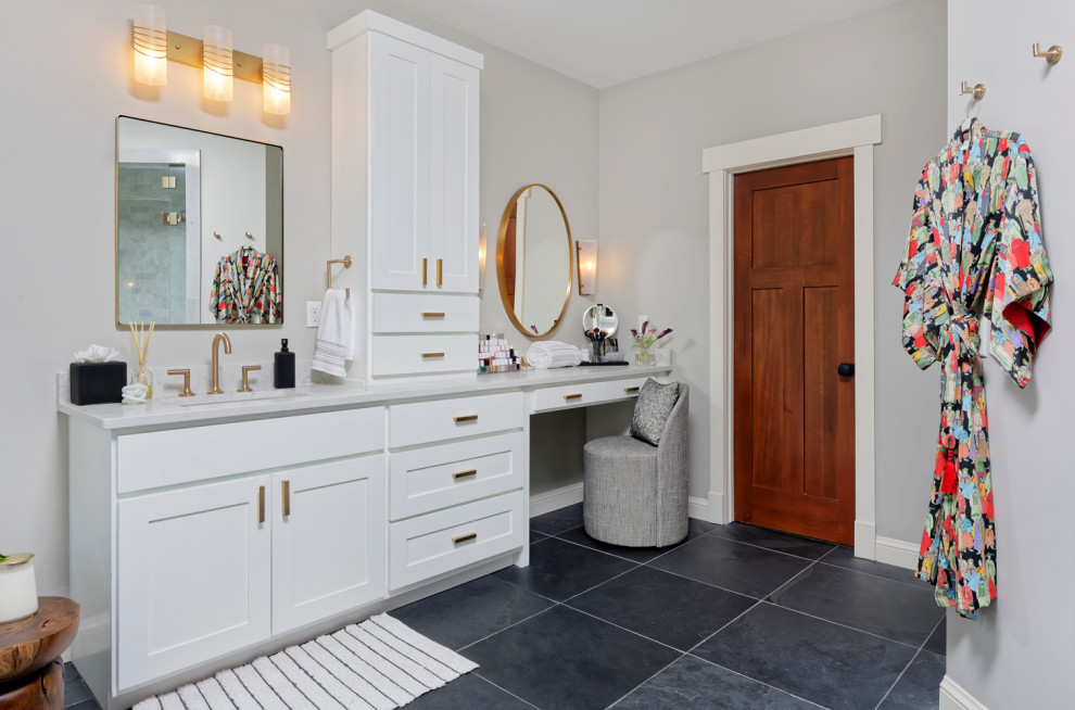 Design ideas for a medium sized contemporary ensuite bathroom in Denver with shaker cabinets, white cabinets, a built-in bath, a shower/bath combination, a one-piece toilet, grey walls, marble flooring, a submerged sink, a single sink and a built in vanity unit.