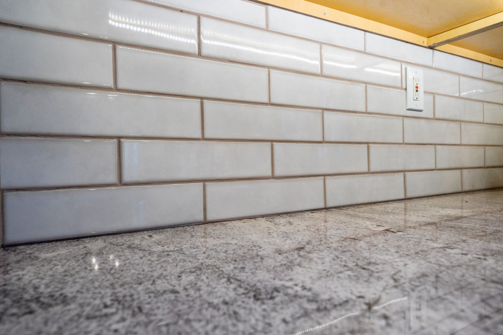 Example of a transitional garage design in Boston