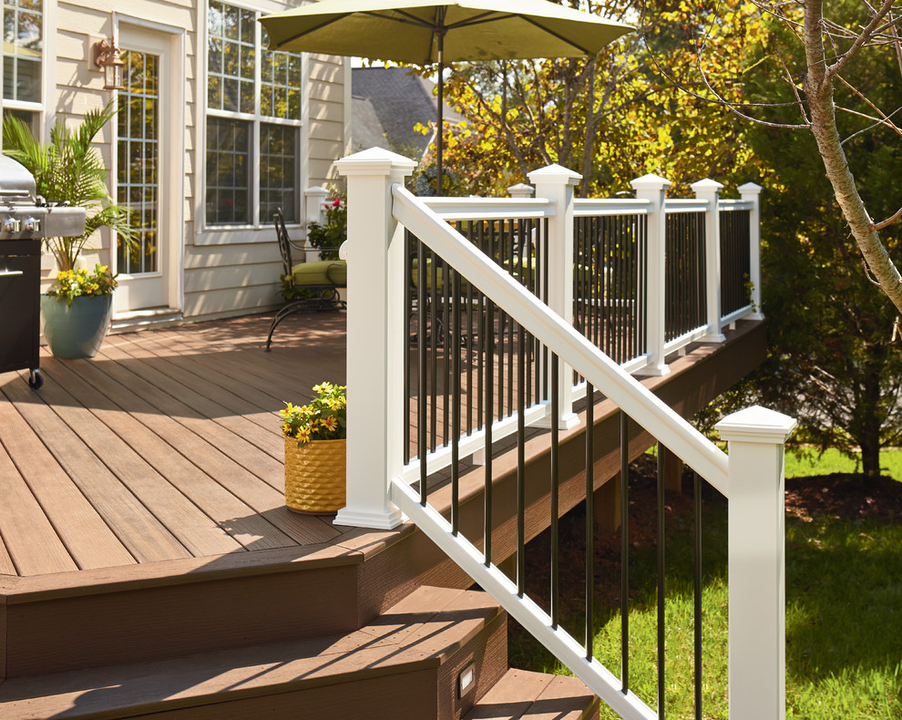 This is an example of a large traditional backyard deck in Other with no cover.
