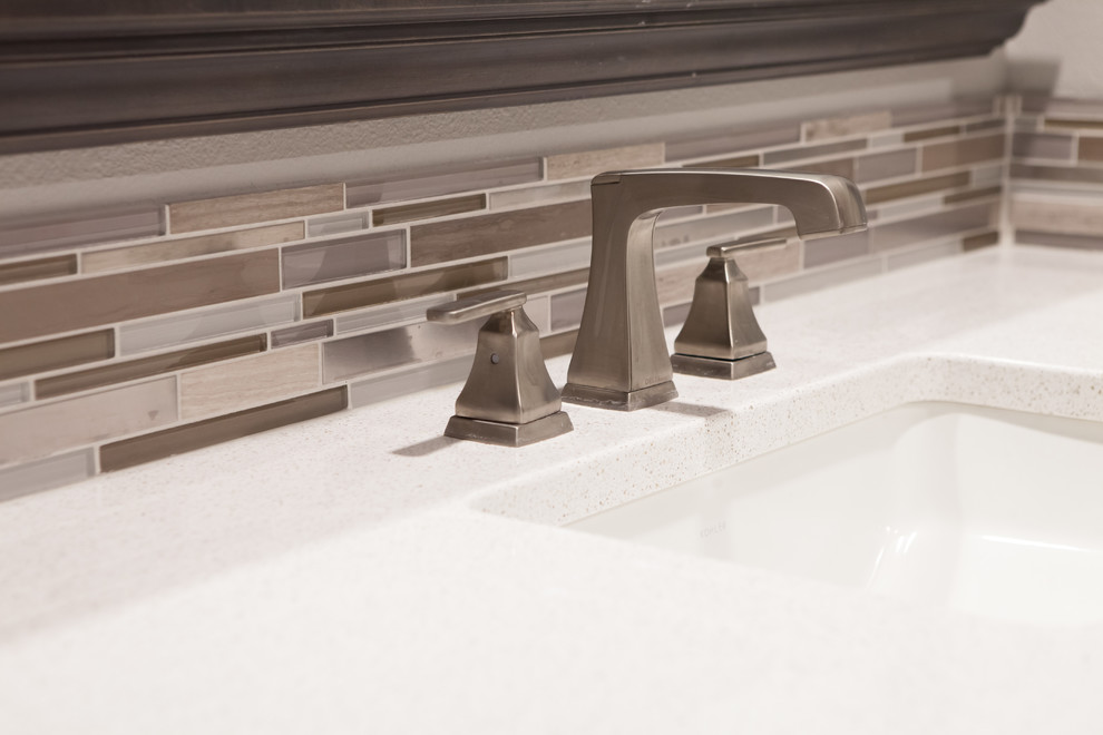 Transitional master gray tile ceramic tile alcove bathtub photo with recessed-panel cabinets, dark wood cabinets, gray walls, an undermount sink and quartz countertops