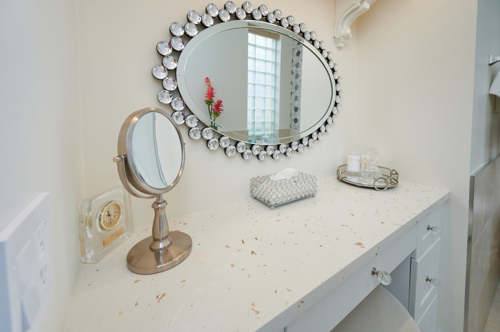 Freestanding bathtub - large transitional master beige tile and porcelain tile porcelain tile, beige floor and single-sink freestanding bathtub idea with shaker cabinets, white cabinets, gray walls, a drop-in sink, quartz countertops, multicolored countertops, a niche and a built-in vanity