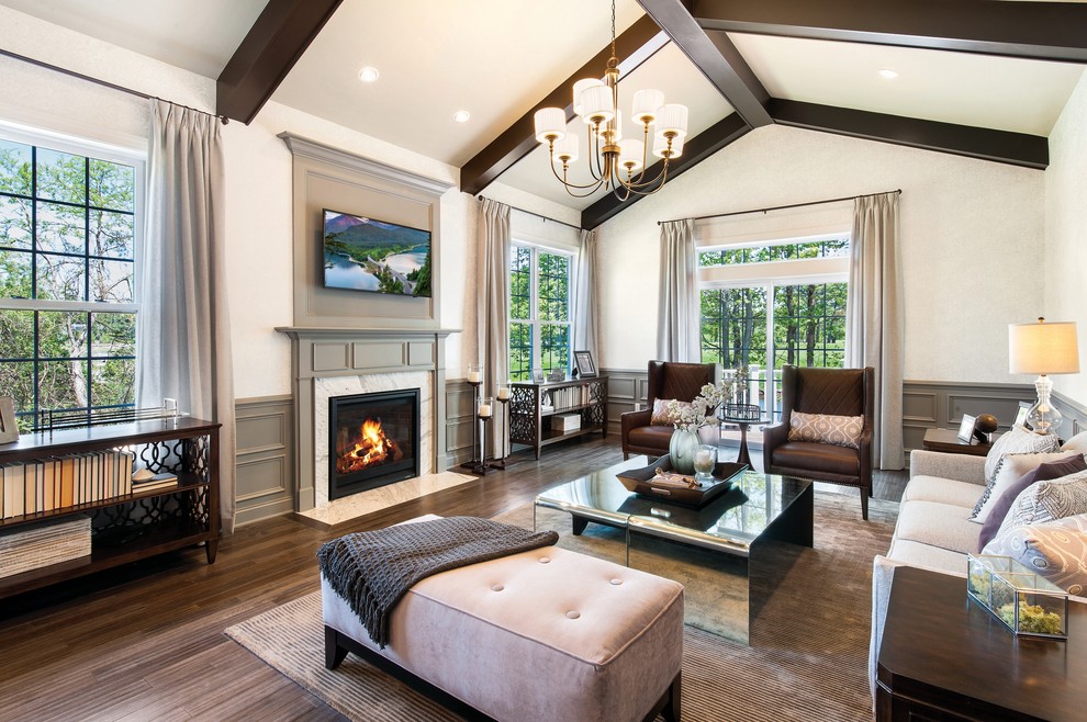 Transitional living room in Philadelphia with white walls, dark hardwood floors, a standard fireplace, a stone fireplace surround and a wall-mounted tv.