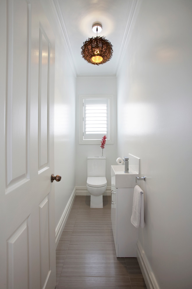 Photo of a contemporary powder room in Melbourne.