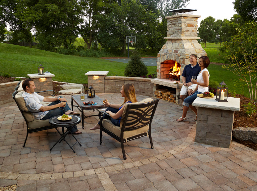 Patio - mid-sized traditional patio idea in Minneapolis with a fireplace