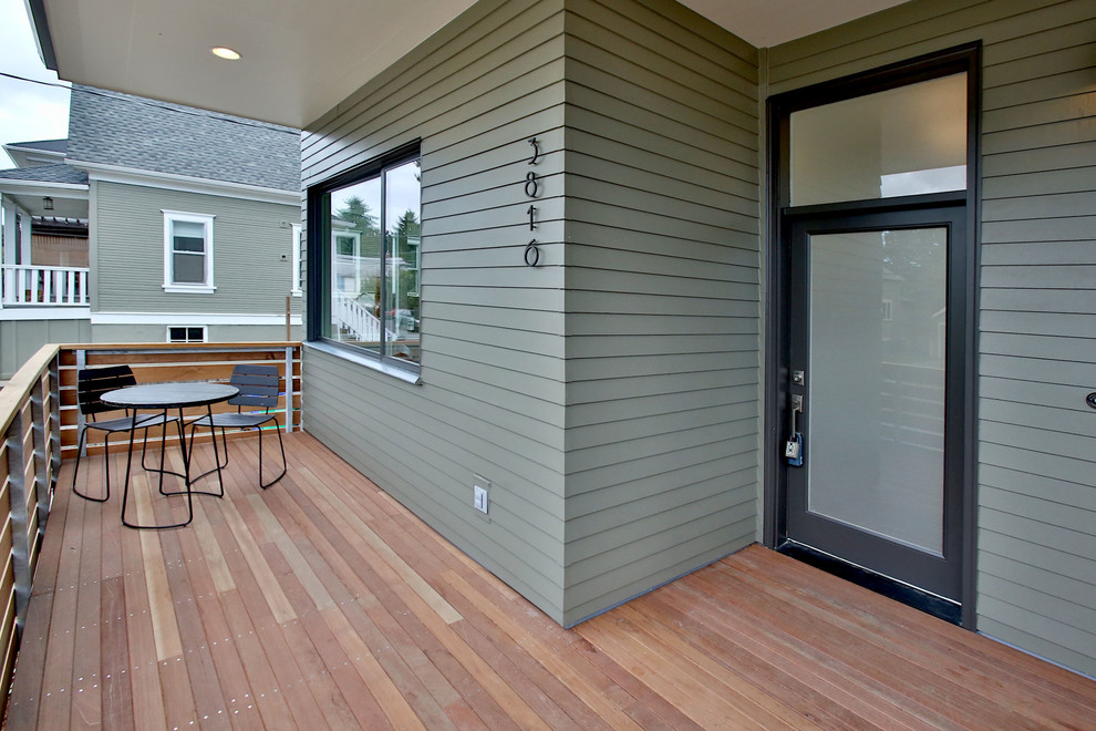 This is an example of a contemporary entryway in Portland with a black front door.