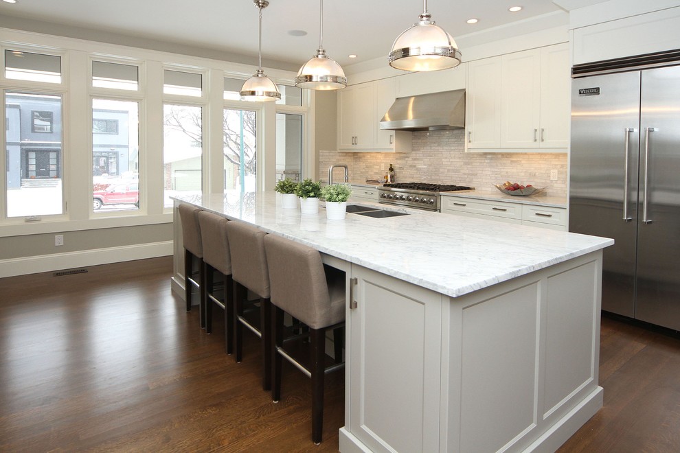 Example of a transitional kitchen design in Calgary