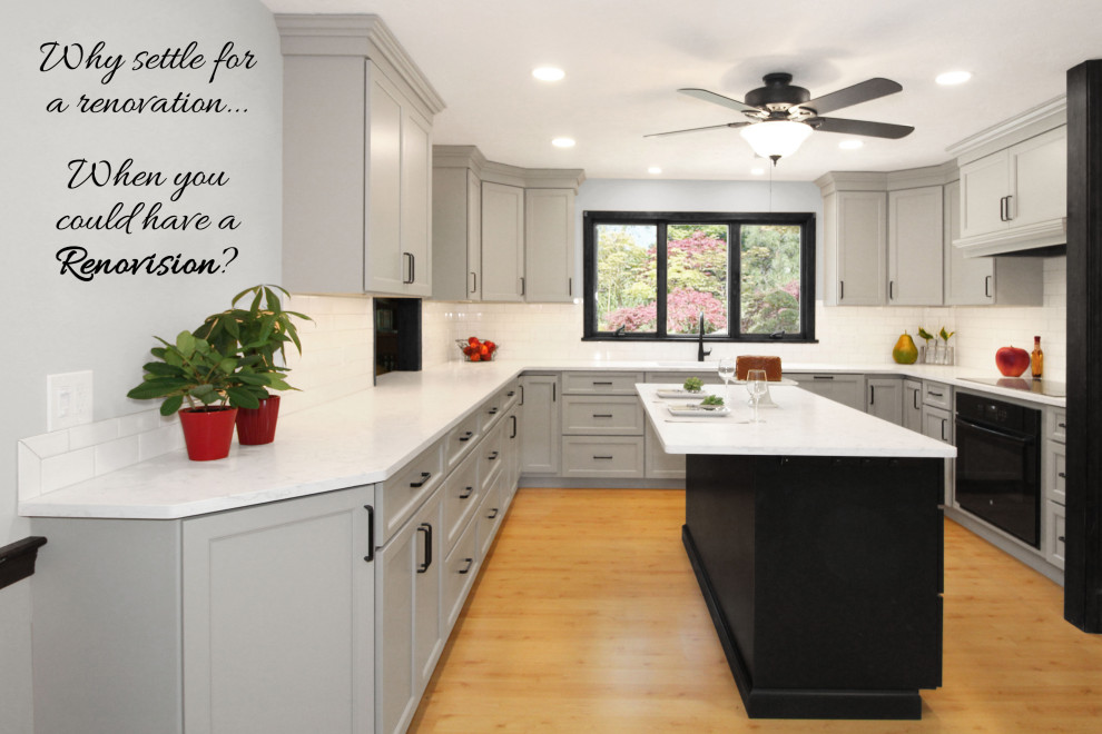 Enclosed kitchen - large transitional u-shaped light wood floor and brown floor enclosed kitchen idea in Boston with a double-bowl sink, shaker cabinets, gray cabinets, quartz countertops, white backsplash, porcelain backsplash, black appliances, an island and white countertops