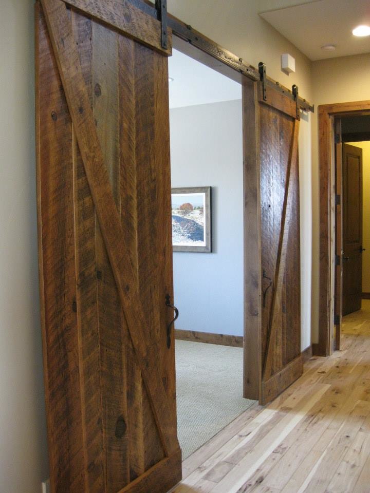Example of a mid-sized mountain style light wood floor hallway design with beige walls