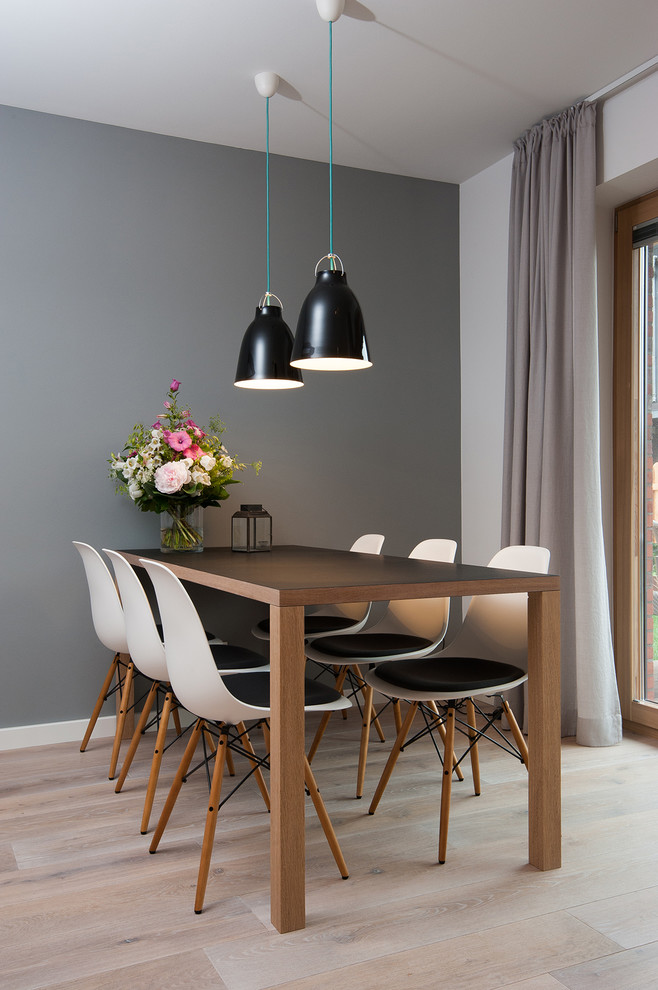 Design ideas for a small scandinavian dining room in Other with grey walls and light hardwood floors.