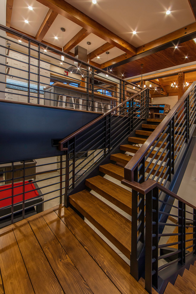 Design ideas for a large contemporary wood u-shaped staircase in Denver with open risers.