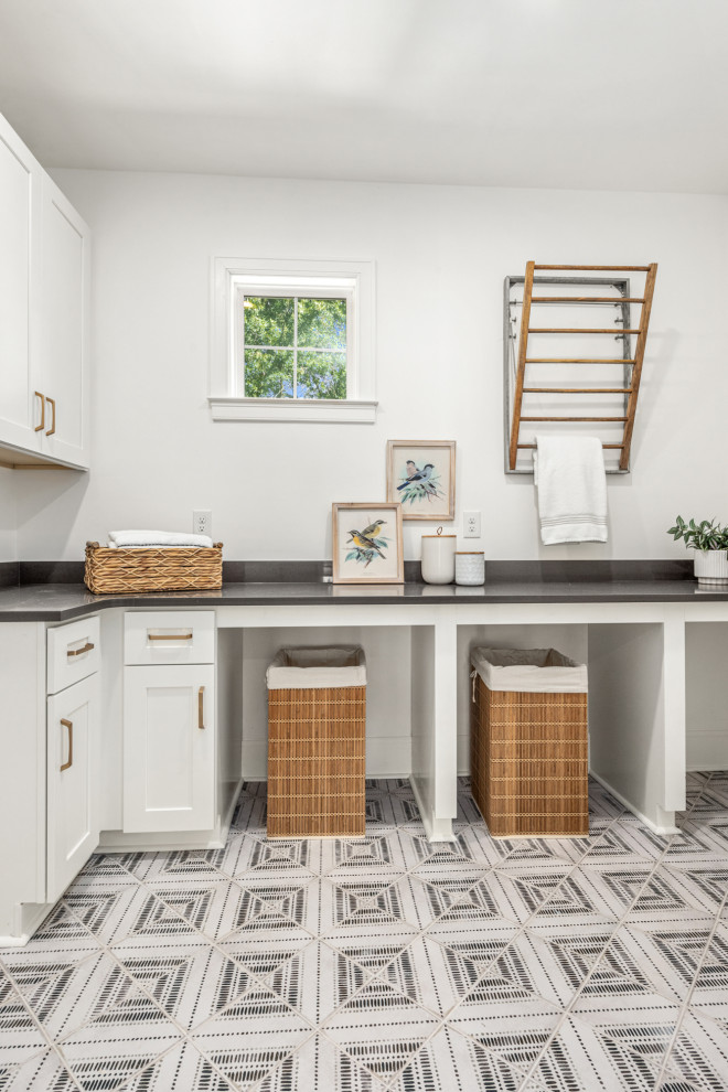 Inspiration for a transitional multicolored floor dedicated laundry room remodel in Charlotte with white cabinets