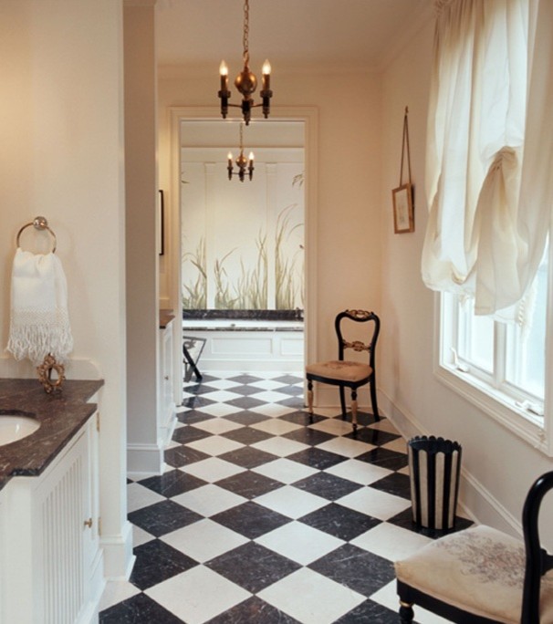 Traditional master bathroom in DC Metro with louvered cabinets, white cabinets, black and white tile, beige walls, marble floors and marble benchtops.