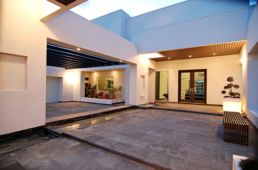 This is an example of a modern entryway in Austin with a double front door and a glass front door.