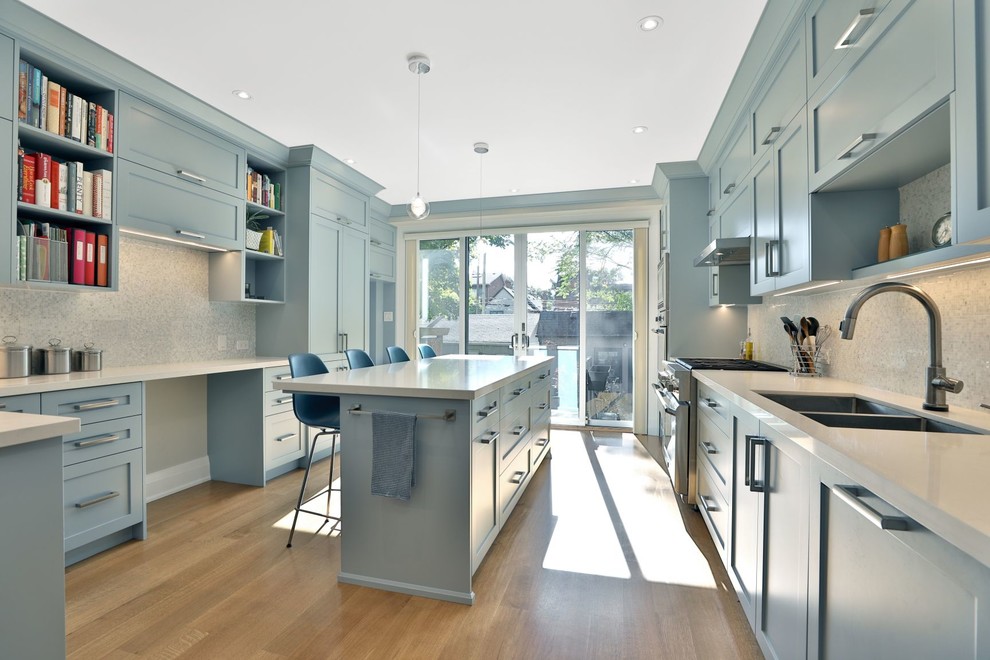 Example of a transitional kitchen design in Toronto